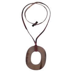 Hermes Lacquered Buffalo Horn Isthme Pendant Necklace Large ring dis pendant in brown/burgundy lacquered buffalo horn. Featuring adjustable fabric cord and 'Hermes' engravement. Size – One Size Condition – Good/Very Good (Scratches to the pendant) Composition – Buffalo Horn Comes with – Necklace Only 22k Gold Necklace, Large Pendant Necklace, Modernist Jewelry, Gold Link Chain, Gold Medallion, Contemporary Pendant, Tourmaline Necklace, Medallion Necklace, Modern Necklaces