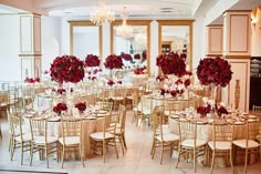 a room filled with tables and chairs covered in flowers