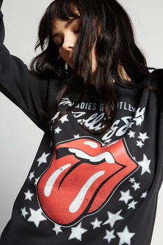 Our next band needs no introduction. This bold graphic sweatshirt features the band's iconic lips and tongue logo with the title of their 1974 movie "Ladies & Gentlemen: The Rolling Stones". Made with soft washed fabric, a crew neckline, ribbed hems, and a slightly fitted style. The Black Crowes, Joan Jett, Billy Joel, Janis Joplin, Original Fashion, Def Leppard, Black Sabbath, Boyfriend Tee, Workout Sweatshirt