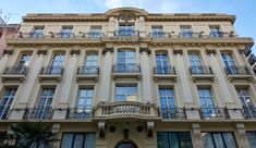 a large building with many windows and balconies