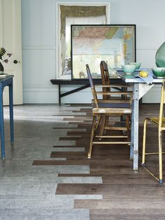 a dining room with blue chairs and green vases