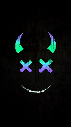 a black background with green, purple and blue lights in the shape of a smiley face