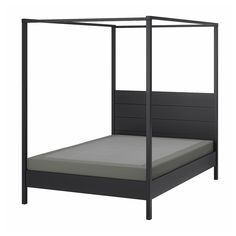 a bed with a metal frame and mattress