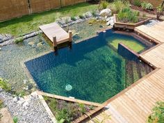 a small pond in the middle of a wooden deck