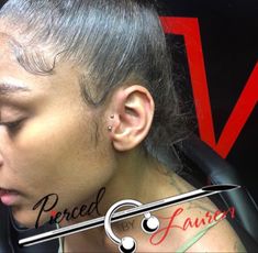 a woman with piercings on her ear and behind her ear is an image of the same person's face