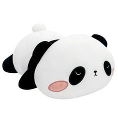 a stuffed panda bear laying on its side