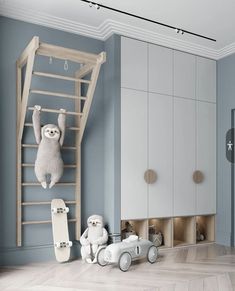 two stuffed animals hanging from a ladder in a child's room with toys on the floor