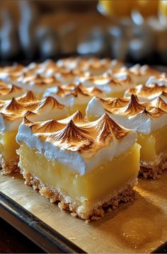 there are many desserts on the tray ready to be eaten