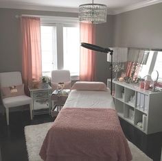 a bedroom with a bed, chair and desk in it's centerpieces