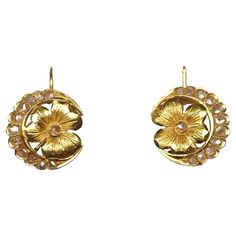 Floral design Art Nouveau earrings set in gold with rose cut diamonds. Lever back fastening. Highlights - Gold 18ct - Rose cut diamonds - Art Nouveau period 1900s c.a. Measurements - Diameter 1.4cm - Weight 4.5gr Art Nouveau Rose Gold Jewelry For Gift, Formal Art Nouveau Diamond Jewelry, Art Nouveau Yellow Gold Jewelry With Rose Cut Diamonds, Art Nouveau Rose Cut Diamond Jewelry, Art Nouveau Gold Flower Jewelry, Design Art Nouveau, Art Nouveau Earring, Rose Cut Diamond, Diamond Art