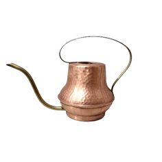 a copper colored metal watering can with a long hose attached to the top and bottom