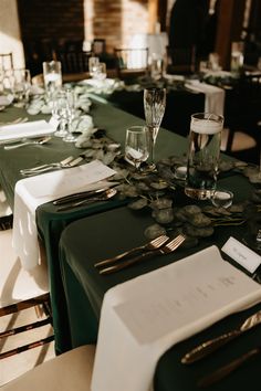 the table is set with place settings and silverware for guests to sit down at