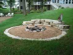 a fire pit in the middle of a yard