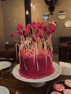 a red cake sitting on top of a white plate