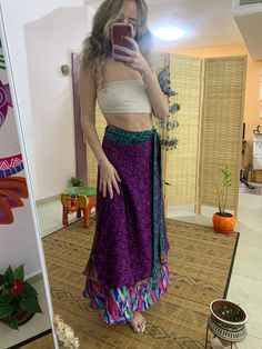 This unique wrap skirt is a one of a kind in the hole world ✨ The fabric goes on it's one unique story as it is a  one of a kind recycled vintage silk hand picked from unique places and villages 🌱 The fabric also  is so soft and silky and has so many small details that make just that much more Beautiful  ⚛️ It's a 2 in 1 skirt ! As you can where it in its 2 defrent sides✨ Skirt is great for every day, And also luxurious and Stunning for evening where. 🌞 Fabric is is the best thing about it, An Traditional Long Wrap Skirt For Beach, Bohemian Flared Wrap Skirt For Festival, Bohemian Long Wrap Skirt With Lining, Bohemian Flared Maxi Skirt With Lining, Hippie Style Flowy Wrap Skirt For Festival, Flowy Bohemian Maxi Skirt Asymmetrical, Flowy Lined Wrap Skirt, Bohemian Purple Tiered Skirt, Bohemian Tiered Purple Skirt