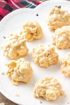 some cookies are sitting on a white plate