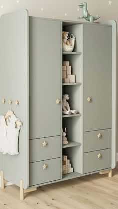 a baby's room with an armoire that has shoes on the bottom shelf