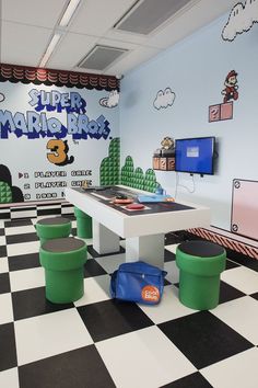 a room with black and white checkered flooring and walls painted in mario bros colors