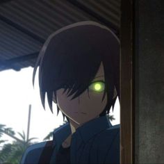 an anime character with green eyes and black hair, standing in front of a building