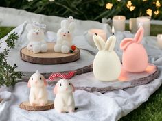 some bunny figurines sitting on top of a table