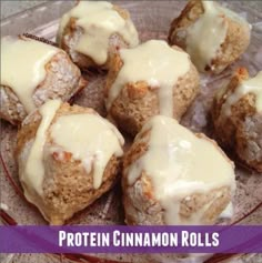 a plate full of cinnamon rolls with icing on them and the words protein cinnamon rolls