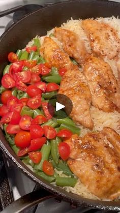 chicken and vegetables cooking in a skillet on the stove