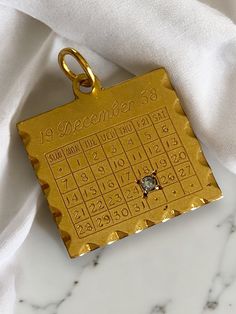 Vintage 14K Yellow Gold DIAMOND December 25th 1958 Date Calendar Charm Pendant! AMAZING Custom vintage charm! * This charm is square in shape, measuring approximately 1" with bale x 3/4" and has "19 DECEMBER 58" written at the top and numbers on all of date squares with a genuine diamond on December 25th! * Back inscribed "To Margie, From Mary". sold as in original condition, but could be polished off by your local jeweler! * Hallmarked 14K  * Weighs 2.4 grams Ships FAST and FREE, fully insured and gift boxed :) Date Squares, Vintage Gold Watch, Presents For Girlfriend, Gold Watches Women, Bling Earrings, Vintage Fine Jewelry, Date Calendar, Bling Rings, Look Vintage