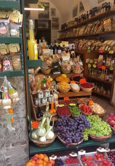 an assortment of fruits and vegetables on display in a store