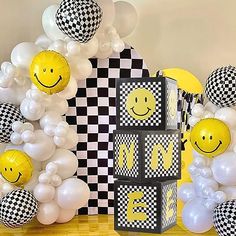 balloons and decorations with smiley faces on them