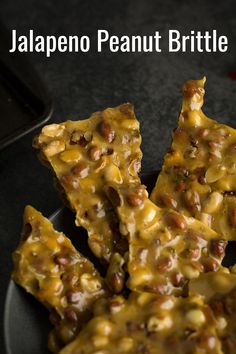 pieces of food on a plate with text overlay that reads jalapeno peanut brittle