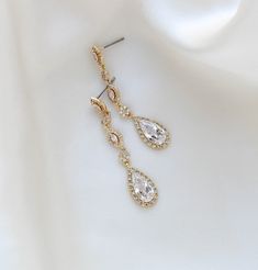 Our Bijou Bridal teardrop earrings are long, sleek and set in rose gold finish with Premium cubic zirconia stones - Premium cubic zirconia stones - All clear stones - Rose gold, yellow gold or rhodium (white gold)- Earrings measure 1-7/8 inches x 3/8 inch- Nickel free and hypoallergenicThis is an original design by © Treasures by Agnes Teardrop Bridal Earrings, Gold Bridal Earrings, White Gold Earrings, Clear Stone, Cz Stone, Bridal Earrings, Gold Yellow, Teardrop Earrings, Gold Finish