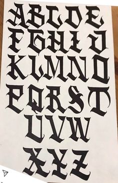 the upper and lower letters are made out of black ink, with white paper underneath them