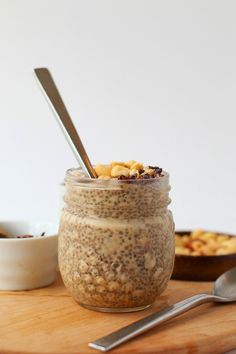 a jar filled with oatmeal sitting on top of a wooden table