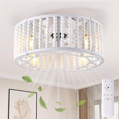 a white chandelier hanging from the ceiling in a living room