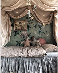 an instagram photo of a bed with curtains and pillows