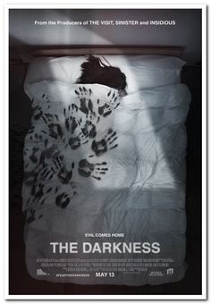 the darkness movie poster with hand prints on white sheets and black background, in dark room