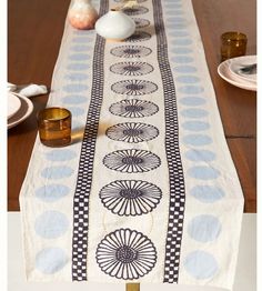 the table runner is decorated with black and white designs