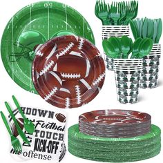 green and white paper plates, cups, and utensils are arranged in the shape of footballs