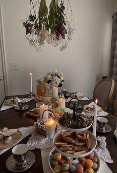 a table is set with plates and candles