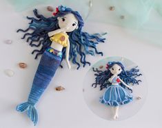 a crocheted mermaid doll next to a needled doll with long blue hair