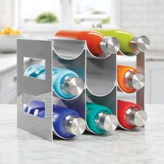 a multi - colored wine rack on a kitchen counter