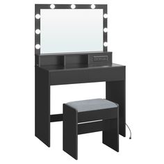 a black vanity with lights on it and a stool