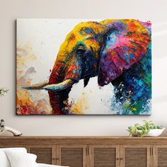 an elephant painted on the wall above a bed