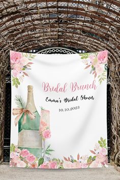 a bridal bridal shower sign hanging from a wooden structure with flowers on it