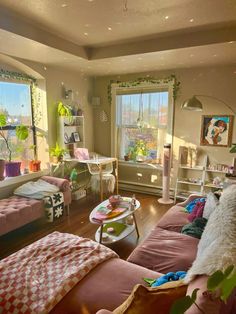 a living room filled with furniture and lots of windows