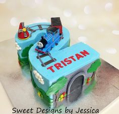 a thomas the train birthday cake on a table