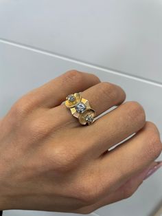 0.15 Ct Round Shape Natural Diamond Vintage Ring || Solid 14k Yellow Gold || Estate Jewelry || Hand Made || Free Resizing   ~~ S e t t i n g ~~ Solid 14k Yellow Gold 6.55 grams Ring Size 5.25,5.5,5.75,6,6.25;5.75 US   ~~ Stones ~~  Main Stone: Round Shape Natural Diamond In Weight Of 0.15 Ct (Approx.)  Clarity - Si2 Color  - G  Side Stones: Old Mine Shape Natural Diamond In Weight Of 0.08 Ct (Approx.) Clarity - I1 Color  - G  So who is Nola? Nola is our creation and imagination. All the idea of Nola is to bring the legacy and our passion to you, that obviously looking to find a unique and one-of-a-kind piece of art. Our hope is to keep finding this exact jewelry for you, from all over the world.  We are Alex & Noam, We've been breathing and living the jewelry industry since we know each ot Estate Rings, Vintage Diamond Rings, Jewelry Hand, Jewelry Manufacturers, Hand Jewelry, Vintage Ring, Ring Vintage, Jewelry Handmade, Estate Jewelry