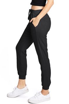 Light weight linen jogger pants with a high rise fit, a stretchy smocked waist and a drawstring tie. Pockets on the front and back. CARE | Machine Wash Cold CONTENTS | 55% Linen 45% Viscose MEASUREMENTS | 35"/89 cm Top to Bottom 25"/64 cm Inseam 10"/25 cm Rise (Size Small) MODEL | 5'8 - wearing a size Small IMPORTED Loosely Fitted Pull-on Style Sweatpants, Comfortable Elevated Casual Bottoms, Relaxed Fit Joggers With Elastic Waistband, Cotton Bottoms With Gathered Waist, Versatile Tapered Leg Sweatpants, Versatile Tapered Leg Pull-on Sweatpants, Elevated Casual Mid-rise Bottoms With Elastic Waistband, Mid-rise Bottoms With Elastic Waistband For Elevated Casual, Comfortable Ankle-length Joggers With Elastic Waistband