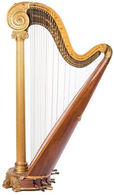 an ornately decorated golden harp on a white background