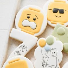 decorated cookies in the shape of lego characters